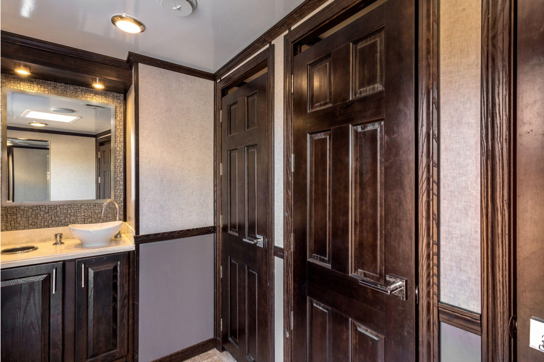 Interior stalls and sink of luxury porta potty rental