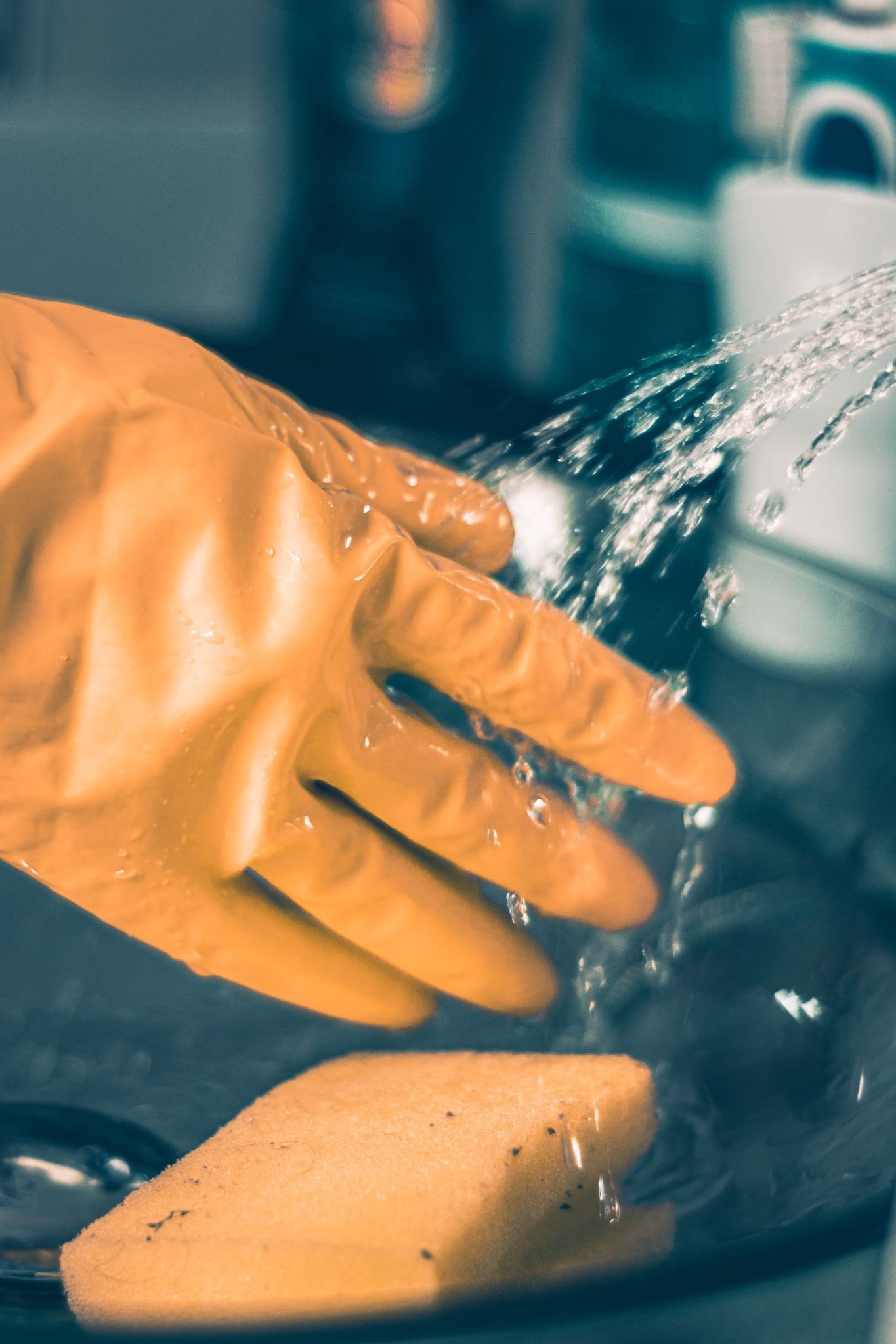 cleaning with rubber glove and sponge