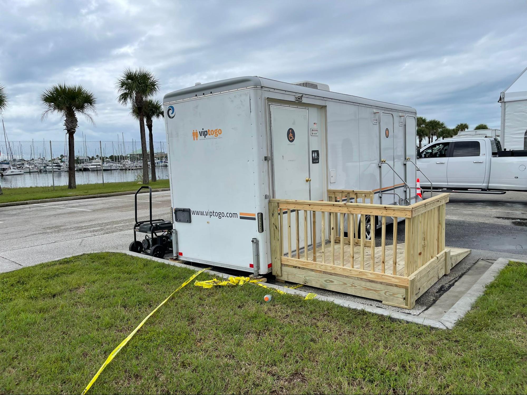 portable restroom trailer with ADA handicap-accessible unit