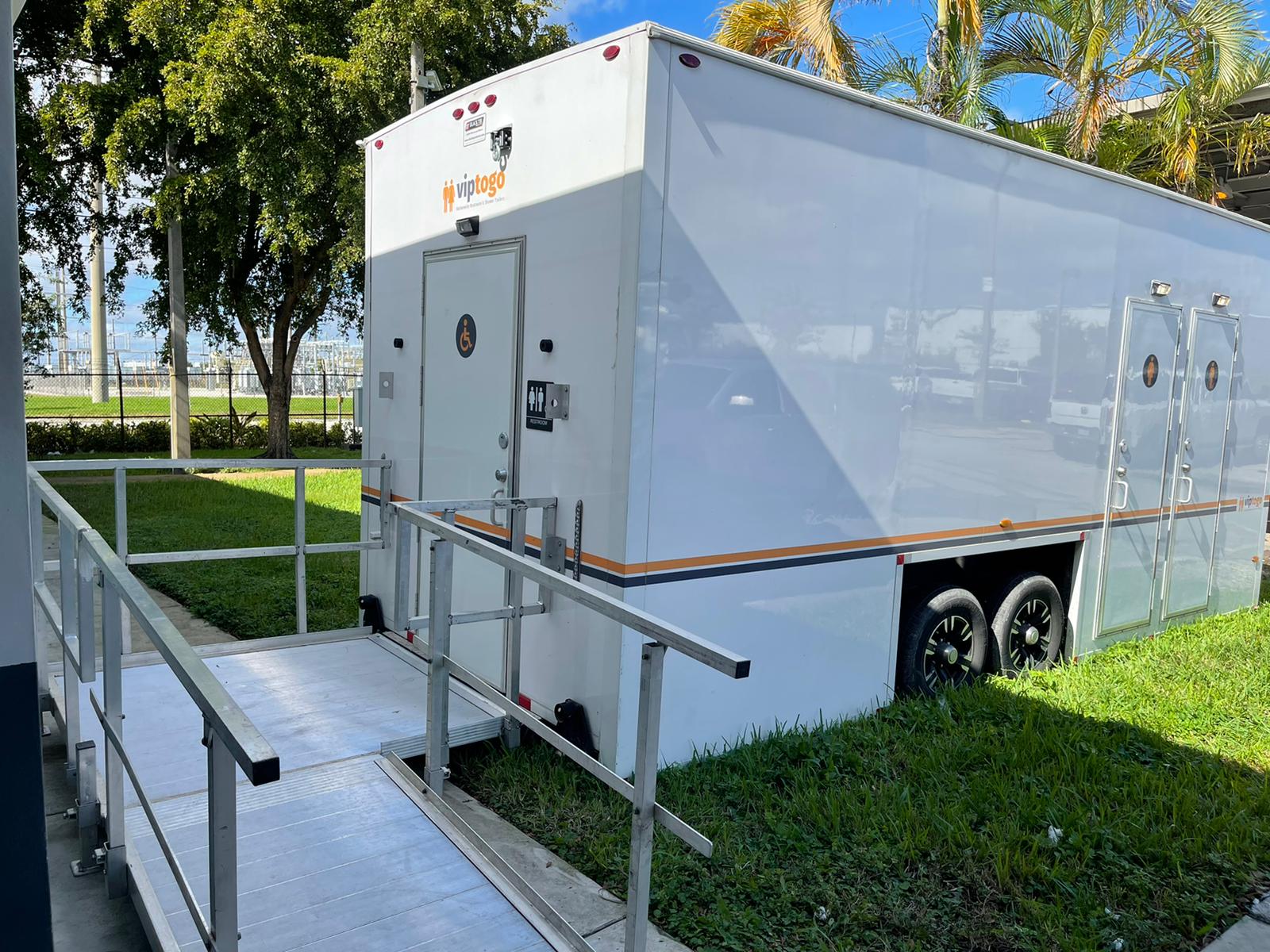 Outdoor restroom with handicap access ramp