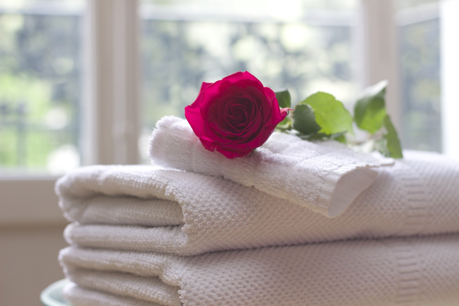 pile of white towels for mobile shower trailer