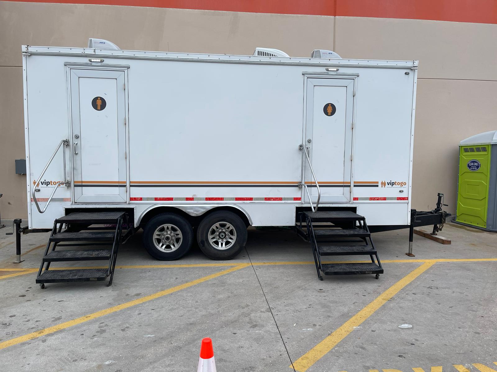 portable toilet trailer rental outside store