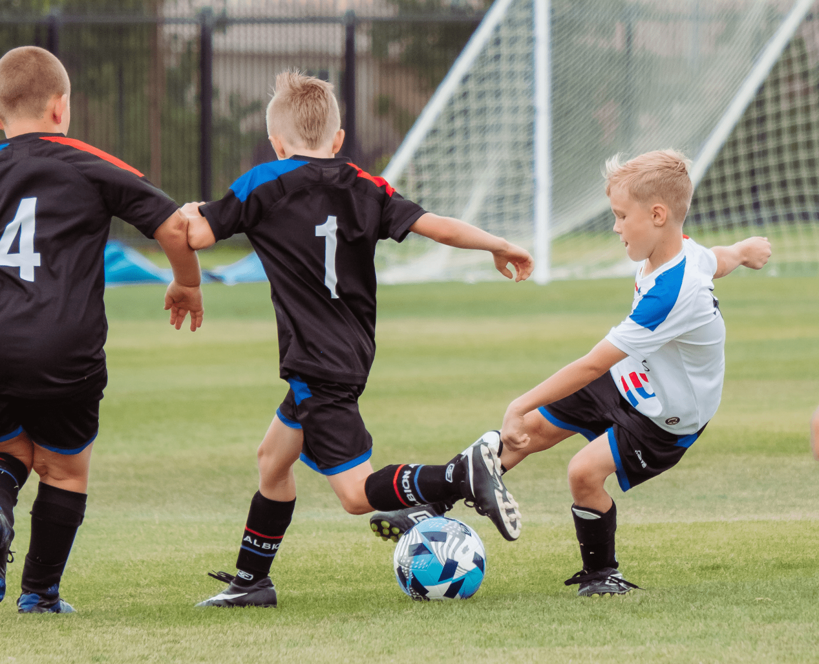 boys playing sports outdoors